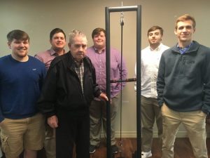 NHC resident , 93 year old Lloyd Tisdale receives a workout machine to help stay in shape made by DCHS students Hunter Fann, Logan Cornelious, Noah Gill, Zach Day, Nathan Atkins through the STEM Technology and CTE programs in partnership with NHC Health Care Center of Smithville