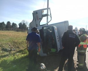 Box Truck Crash on Allen Ferry Road. Picture shows occupant climbing out of cab uninjured