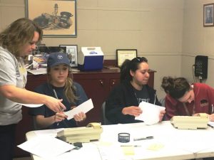 Trina Hedge and DCHS Class of 2019 members Macy Hedge, Dulce Maciel, and Anna Rachel Blair taking pledges during WJLE Radiothon for Project Graduation