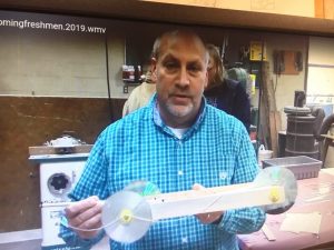 Brad Leach- CTE Director and Engineering Teacher shows self propelled mouse trap car built by students using 3D Technology