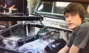DCHS CTE Automotive Technology Class (Student working to install engine in truck)