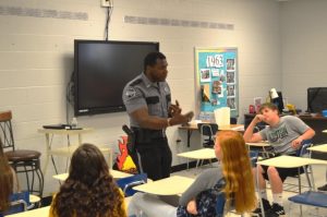 SRO Lewis Carrick speaking to students about law enforcement careers at Career Day
