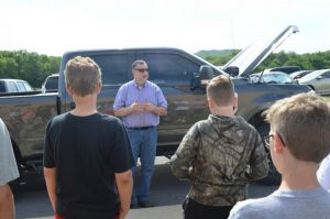 Mike Whitehead, D.C.H.S. Auto Mechanics teacher, popped the hood and spoke to students about the different careers available in mechanics