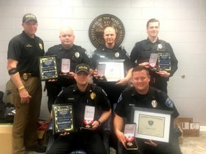 Members of the Smithville Police Department who put their training and experience to the test in saving the lives of two people recently were recognized and awarded by Police Chief Mark Collins. Seated: Sergeant Lance Dillard and Officer Brandon Donnell. Standing-Chief Collins and Officers Andy Snow, Will Judkins, and Tyler Patterson