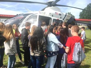 DeKalb Middle School Students wait their turn to get a closer look at a Vandy Life Flight Helicopter Ambulance on Career Day