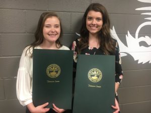 DCHS Class of 2019 Salutatorian Megan Redmon and Valedictorian Madison Cantrell proudly hold resolutions paying tribute to them as adopted in the State House of Representatives and State Senate and signed by the Governor. The presentations were made Friday by State Senator Mark Pody and State Representatives Terri Lynn Weaver and Clark Boyd.