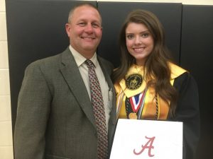 DCHS Principal Randy Jennings congratulates Madison Cantrell who received the most scholarship awards totaling over $300,000