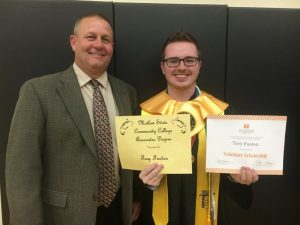Trey Fuston was recognized for having completed two years of college at Motlow State Community College . Fuston has earned an Associate degree. Pictured with DCHS Principal Randy Jennings.