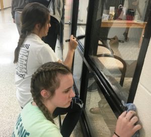 Students Addison Puckett and Bella France participating in DCHS Beautification Day