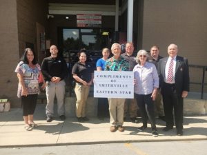 (PICTURED: #3 Smithville Chapter #374 leaders of the Order of the Eastern Star showed their appreciation to the DeKalb County Sheriff’s Department Wednesday by donating three cases of bottled water. Pictured: Gay Vanatta, Dr. Jerry Paul Vanatta, Pat Wilt, and Dr. Robert R. Atnip with members of the Sheriff’s Department/Jail Staff)