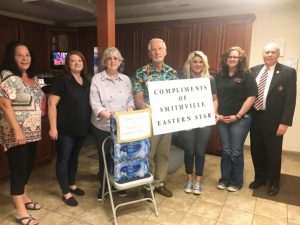 (PICTURED: #4 Smithville Chapter #374 leaders of the Order of the Eastern Star showed their appreciation to the DeKalb County Emergency Communications District (Central Dispatch/911 Center) Wednesday by donating three cases of bottled water. Pictured: Eastern Star Organist Gay Vanatta, 911 Dispatcher Chrystal Reed, Eastern Star Worthy Matron Pat Wilt, Worthy Patron Dr. Jerry Paul Vanatta, 911 Dispatchers Sasha Avera, Shelly Mulford, and Eastern Star Chaplain Dr. Robert R. Atnip)