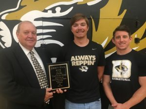 Roy Nelson Pugh of Liberty State Bank (left) presented a plaque to Tanner Poss for scoring 1,159 points in his high school basketball career. Joined by DCHS Tiger Basketball Coach John Sanders