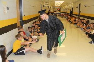 DeKalb West School students greeted members of the DCHS Class of 2019 as they made their annual Senior Walk through the halls of the school (Bill Conger Photo)
