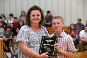 Lisa Hayes presents the Mrs. Georgia Young award to Cameron Bailey in honor of her mother, who served for many years as DWS Cafeteria Manager. (Pat Parkerson Photo)