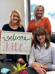 Juvenile Case Manager Katie Parker (standing left) and Adult Case Manager Rhonda Harpole (standing right) welcome Kate Arnold (seated) as the new Coordinator of the DeKalb County Recovery Court Program.