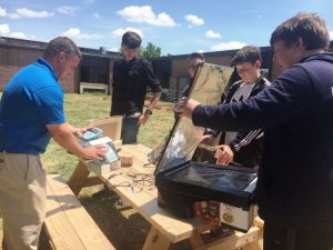 An honors physics class at DCHS was the first to take advantage of the new Outdoor Learning Space and Garden at DCHS. Teacher and Coach Dylan Kleparek took his class outdoors last Thursday to test solar ovens made by the students.