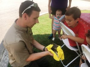 Seasonal Park Ranger Andrew Webber at Edgar Evins State Park showed off “Otis" a baby opossum for children to see and touch during Saturday’s National Trails Day observance at the park.