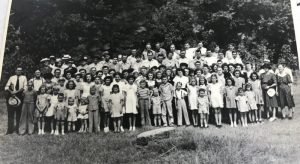 Photo shows gathering for the last worship service on Indian Creek before the church moved to its current location