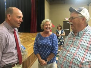 Danny Parkerson and his wife Pat greet Tennessee Department of Agriculture Commissioner Charlie Hatcher during his visit to Smithville Thursday