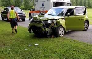 The driver of a 2014 Kia Soul crashed into a mailbox and a utility pole Friday on Big Hurricane Road after suffering a medical episode. (Jim Beshearse Photo)