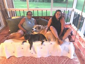 Gayla Hendrix and her daughter Abi, a veterinarian tech at DeKalb Animal Clinic, with their adopted pets, Pal and Sketti, who are very excited about the new dog park.