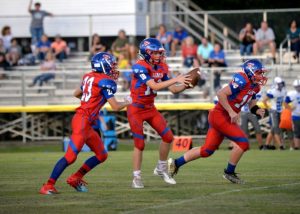 Saints Quarterback Briz Trapp gets the ball to make a play in Thursday's 22-6 Homecoming win over Overton County (Tena Edwards Photo)