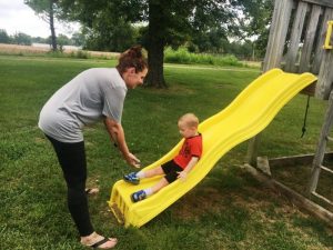 Amy Reed with Andrew Reed enjoying part of their day at the Alexandria Children’s Playground Friday