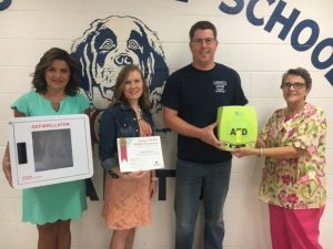 DeKalb Middle School has a new portable automated external defibrillator (AED) thanks to the DeKalb Junior Pro Basketball Program. Matt Quarles, President of the League, made the presentation Monday morning to DMS Principal Lacy Foutch (second from left), Assistant Principal Anita Puckett ( far left), and School Nurse Joanie Williams (far right)