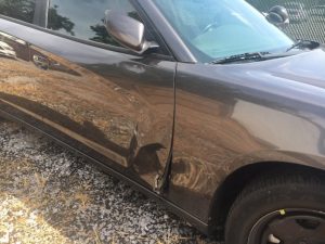 Photo shows damage to Smithville Police Chief Mark Collins patrol car caused when Marty Tallent rammed it in the passenger side with his vehicle during pursuit