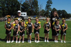 Junior Pro Football Pee Wee Cheerleaders recognized during Homecoming Saturday: left to right- Mia Torres, Kendal Stokes, Lakelynn Rushing, Navaya Knight, Ireland Hobbs, Aubree Bruno, Katy Jo Bowen, and Valerie Khadzhi-Leon. Coaches-Rebecca Waggoner and Kimberly Bowen