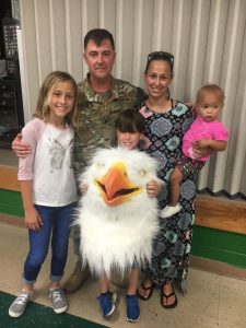 Happy Homecoming: U.S. Army Guard Sergeant Jake Merriman arrives home to surprise his children at school. Pictured left to right daughter Hailee, Sergeant Merriman, son Austin, wife Joyce, and one year old daughter Haverly. The Merriman’s have another daughter, Annabelle (not pictured)