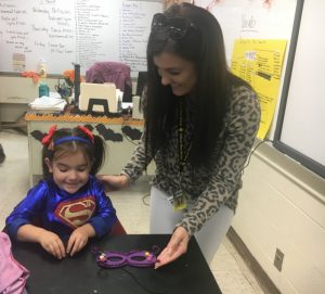 5 year old kindergarten student Lilly Claire Dunaway with DeKalb West School Educational Assistant Makenzie Dunaway at Superhero STEAM night at DCHS Monday