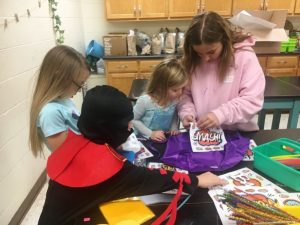 Students learning how to create costumes of their favorite superheroes characters during Superhereos STEAM night at DCHS Monday
