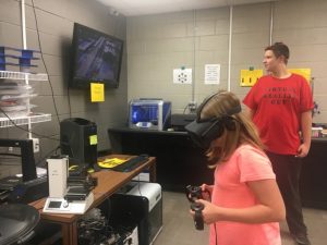 10 year old Chloe Boyd of DeKalb West School playing virtual reality during Superhero STEAM night at DCHS Monday