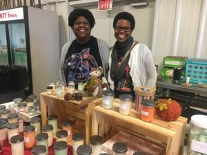 Virginia Crawley and Gina Crawley with candles at Paislee’s Foundation Craft & Home Show Saturday