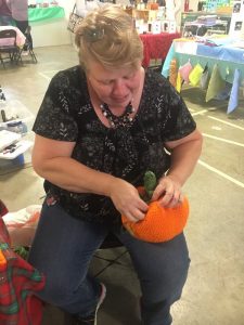 Mary Dunaway of Mary’s Unique Gifts of Knoxville making a crochet pumpkin at Paislee’s Foundation Craft & Home Show Saturday