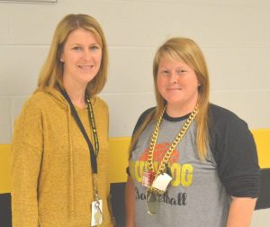 DWS Principal Sabrina Farler presents Karen France with the Teacher of the Month award.