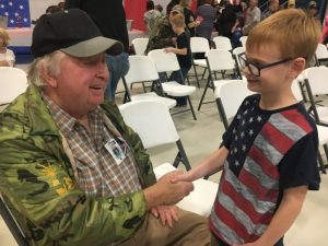 First grader Jackson Longmire shakes hands with Vietnam Era Veteran James Owen after Friday’s Tribute Program at Smithville Elementary School. Owen served in the US Army from 1968-70