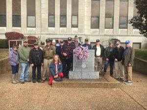 Veterans place wreath at memorial monument following tribute program