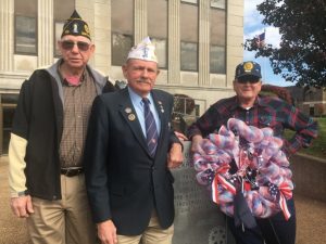 John Davis, Middle Tennessee Vice Commander of the American Legion (center) was the guest speaker at Monday’s Veterans Day observance hosted by the American Legion Post 122. Pictured with Legion Commander William Edmonds (left) and Adjutant Ronnie Redmon and a wreath placed at the Courthouse Veterans Monument.