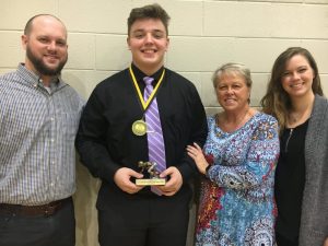 In addition to his MVP trophy, Isaac Cross received the Coach Clay Edwards Memorial Tiger Pride Award for the second year. The Clay Edwards Award was presented to Cross by members of Edwards’ family, Abram Edwards (left) and Sarah Rathbone (far right), son and daughter, and their mother Tena Edwards-Jacobs.