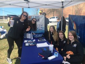 Several DCHS Tigerettes rally support for the “Ford Drive 4 UR School” fundraiser Saturday