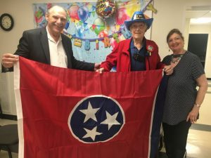 Family and friends joined in the celebration of the 94th birthday for WW II Veterans Edward and Edsel Frazier (twins) Friday at the Smithville First Baptist Church. State Senator Mark Pody presented Edward with a state flag in his honor. Pictured: Senator Pody and Edward with daughter Susan D. Frazier Hinton