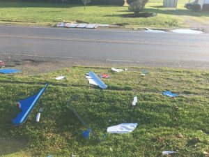 High winds from a powerful storm early Sunday morning caused some structure damage and power outages for several hours in DeKalb County. Picture here shows debris from a broken Mystick Market sign on Highway 56 South.