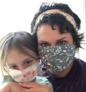 Martha Melching and daughter wearing their own “Masks of Love”