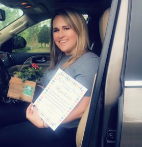Parent Megan Linder receives Top Volunteer Award during Drive Through Head Start Graduation Wednesday