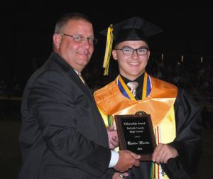 Raiden Martin receives Citizenship Award from DCHS Principal Randy Jennings