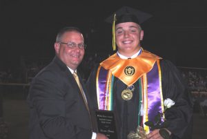 Isaac Cross receives White Rose Award from DCHS Principal Randy Jennings