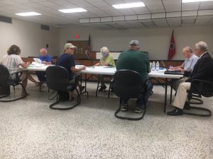 County Budget Committee: Left to right: Anita Puckett (back to camera), Dr. Scott Little, Sabrina Farler, Jerry Adcock, and Jeff Barnes (back to camera) with County Mayor Tim Stribling and County Financial Advisor Steve Bates (Photo from recent meeting)