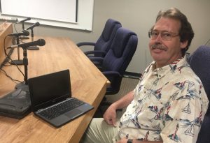 Schools Technology Coordinator Greg Frasier shown here with a chromebook and case. All students in grades K-12 will be assigned a chromebook this coming school year to be used at school and home.